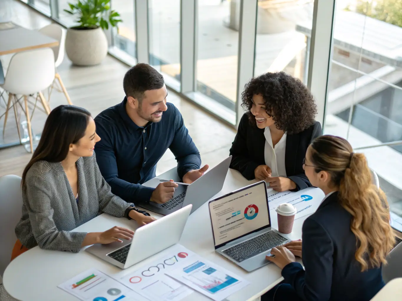 A team of professionals in business attire conducting a lean transformation workshop, using visual management boards and process maps in a bright, modern conference room, suitable for a premium consulting website.